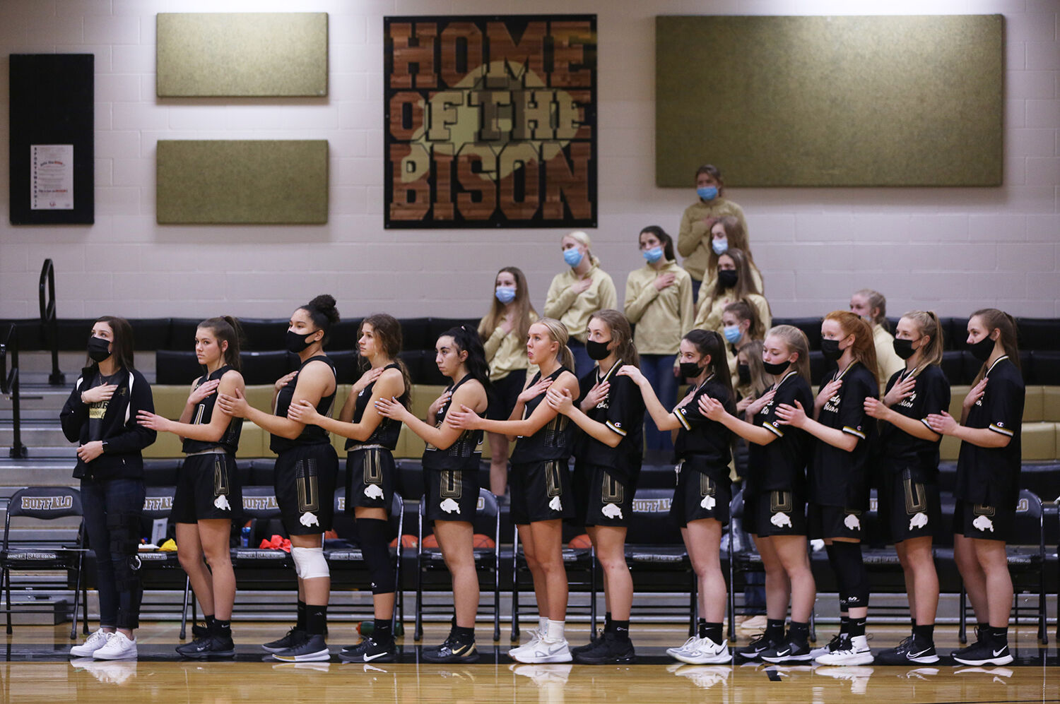 Buffalo’s varsity girls stand hooked together